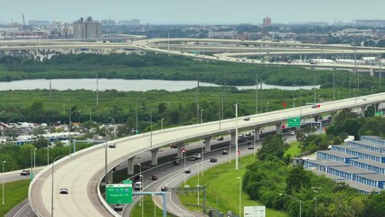 Poster - USA transportation infrastructure concept. View from above of American highway turnpike in Tampa, Florida with fast moving cars