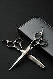 Fototapeta Mapy - Hairdressing scissors with case on a black background