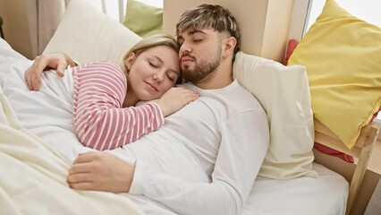 Wall Mural - A loving couple peacefully sleeping together in a cozy, well-lit bedroom with white bedding and colorful pillows