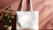 White Tote bag on empty wall.