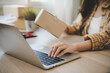 © Pormezz - Efficiently preparing packages for seamless shipping. The hands of an online store meticulously pack and protect products, ensuring a smooth fulfillment process for satisfied customers worldwide.