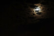 Dark night cloudy sky with glowing full moon, copy space