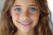 smiling little girl with orthodontic braces
