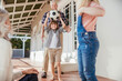 © Marko Geber - Grandparents and grandchildren having fun with a soccer ball on house porch