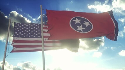 Wall Mural - The Tennessee state flags waving along with the national flag of the United States of America. In the background there is a clear sky