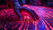 A hand sweeps across a vibrant digital surface, its fingers lightly brushing against a sea of sparkling red and blue lights, evoking a sense of touch in the digital realm.