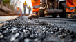 Road Construction Works. Blurred background. Fresh asphalt.
