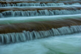 Fototapeta Na ścianę - rippling cascades, waterfall, blurry water