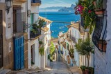Fototapeta Uliczki - A picturesque view of Altea old town, characterized by its narrow winding streets and charming whitewashed houses nestled against the backdrop of the Mediterranean sea in Alicante province