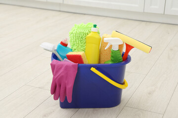 Sticker - Different cleaning supplies in bucket on floor