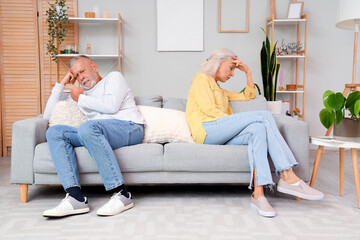 Wall Mural - Upset mature couple after quarrel at home. Divorce concept