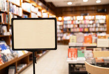 Empty signage board inside a cozy bookstore