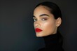 A woman exudes confidence in a black turtleneck, her lips adorned with striking red lipstick