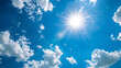 Sky with bright sun and thermometer