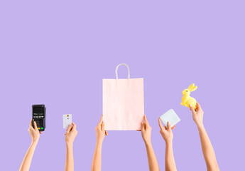 Poster - Women with payment terminal, shopping bag, credit card and wallet on lilac background. Easter Sale