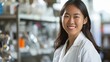 Portrait of an Asian research scientist in a biochemistry lab