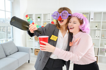 Poster - Business women with drink celebrating April Fools' Day at office party