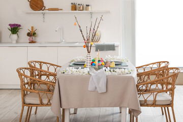 Poster - Festive table serving with painted eggs, flowers and burning candles for Easter celebration