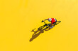 cyclist with a racing bike, top view, isolated on a speed-inspired bright yellow background, denoting motion and endurance
