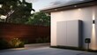 Battery mounted on house, sleek design, no handles, clear sky above. House with large battery, clear sky, solar power, garden view.