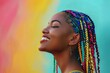 side view of smiling woman with colorful braids