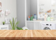 Wood table for display products on background of blurred laundry room