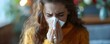Young woman at home sneezing and clearing her nose with tissue. Concept Allergic reaction, Home remedies, Sneezing, Tissue use, Health Maintenance