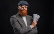 © be free - Man with casino money. Bearded man businessman. Rich Englishman. Retro man isolated on black. Englishman with money. Rich man in retro suit. Brutal gentleman has successful business. Tweed cap