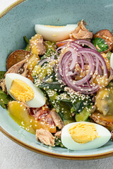 Canvas Print - Top view on portion of tuna salad with eggs and vegetables