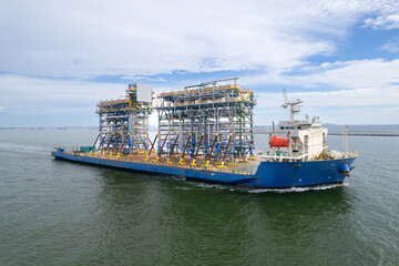 Canvas Print - Top view Logistics and transportation large cargo ship Transporting loads of oil rig parts  Oversized cargo transportation