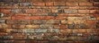 © Ilgun - An aged brick wall shows signs of wear and tear, with a rough and grungy surface. The weathered bricks are discolored, cracked, and covered in dirt and grime.