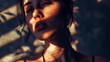 © TPS Studio - A dramatic interplay of light and shadow casts across a young woman's face, creating an evocative and moody portrait.