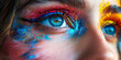Vision in Colour.
Close-up of a woman's eye artistically enhanced with a spectrum of vibrant colours.
