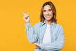 © ViDi Studio - Young smiling happy woman she wearing blue shirt white t-shirt casual clothes point index fingers aside on are mockup workspace isolated on plain yellow background studio portrait. Lifestyle concept.