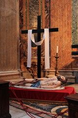 Cross with Statue of Reclining Christ at the Sant'Agnese in Agone Church in Rome, Italy