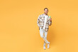 © ViDi Studio - Full body young Caucasian man wear brown shirt casual clothes hold takeaway delivery craft paper brown cup coffee to go isolated on plain yellow orange background studio portrait. Lifestyle concept.