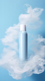 Fototapeta Mapy - Cosmetic bottle with white clouds on blue background, close-up