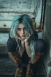 Young girl with blue hair sits sad on the ground. Woman With A Mental Problems, Fear, depression and boredom