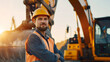 © Yuwarin - Portrait of happy professional excavator driver standing in front of big excavator looking at camera at sunrise