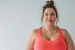 Beautiful overweight Woman smiling and wearing sportswear on background with copy space. Banner of body positivity and No Diet Day with empty place for text