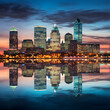Spectacular Illuminated CT City Skyline Reflecting on Calm Waters During Evening Time