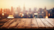Wooden table on blurred city background.