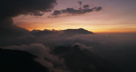 Canvas Print - Drone fly over the sunset over the mountain peak