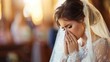 A bride overwhelmed with emotion, her hands covering her face, within a softly lit church, embodying a classic bridal style and the heartfelt sentiment of a wedding day