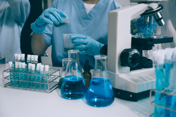 scientist works with a pipette and a test tube. scientific laboratory of biotechnology, development 