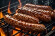 Tasty pork sausages cooking on a hot griddle over open flames, showing the smoke and the browned, crispy casing