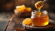 a jar of honey with a wooden dipper