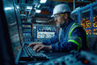 © Attasit - Male engineer wearing reflective clothing and white safety helmet, working with operating a PC, Designing, inspecting, and controlling machinery in automobile factories