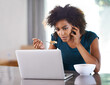 © Mapodile/peopleimages.com - Phone call, eating breakfast and woman on laptop in home for remote work, internet or social media at desk. Smartphone, computer and African freelancer with food at table, cereal and healthy diet