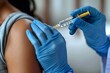 © Pinklife - Detailed image of a medical worker giving an injection to a patient, highlighting the medical procedure and care